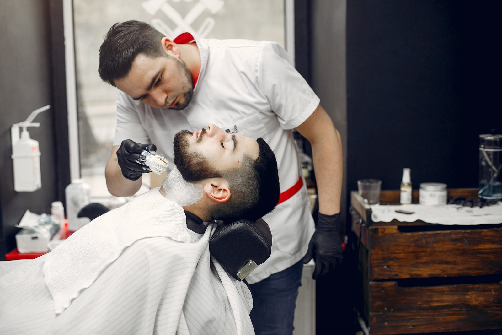 Man with a beard. Hairdresser with a client.